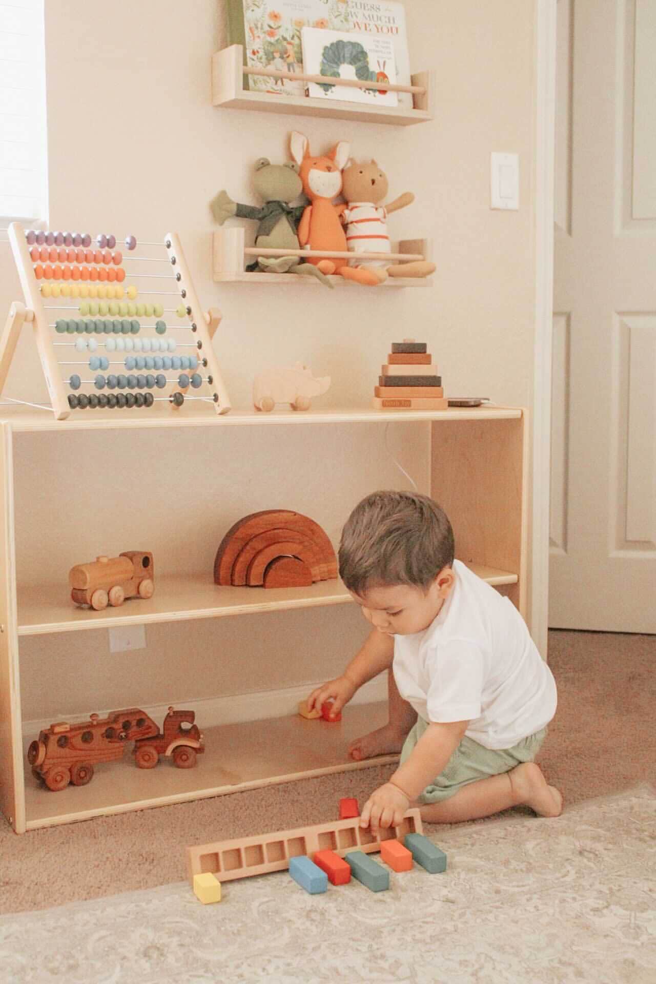 toddler playing with his toys